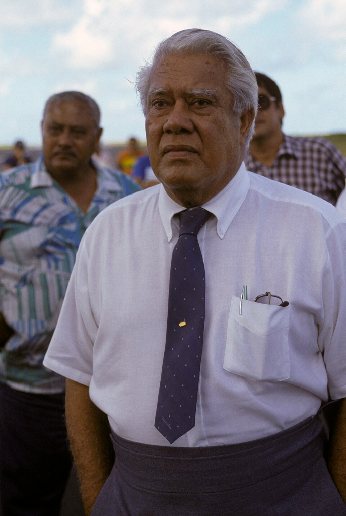Samoan Governor A.P. Lutali looks on as members of the 22nd Military Airlift Squadron unload an emergency generator and equipment at the Pago Pago International Airport. The generator was airlifted to the island aboard a C-5 Galaxy aircraft.